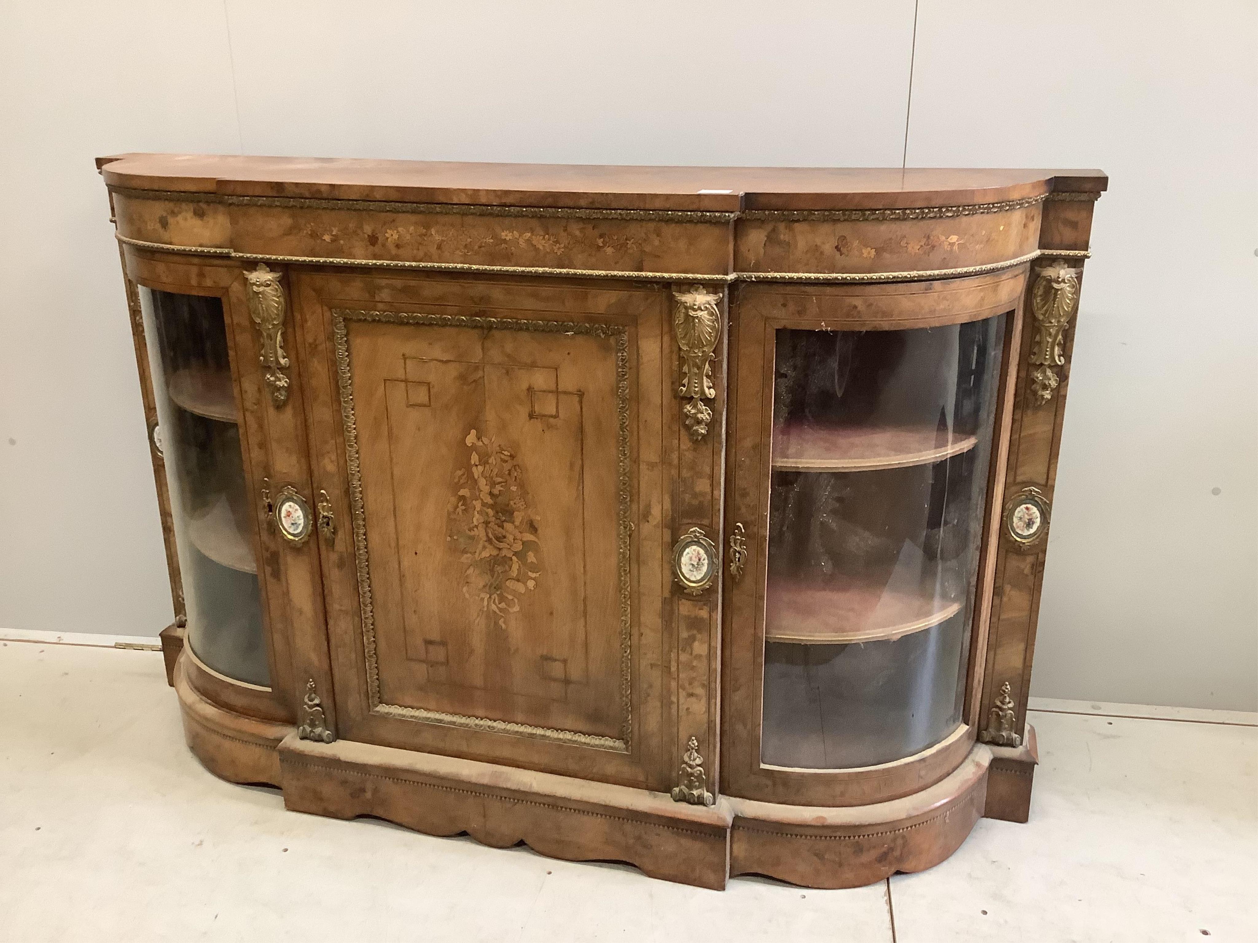 A Victorian marquetry inlaid, gilt metal mounted bowfront side cabinet